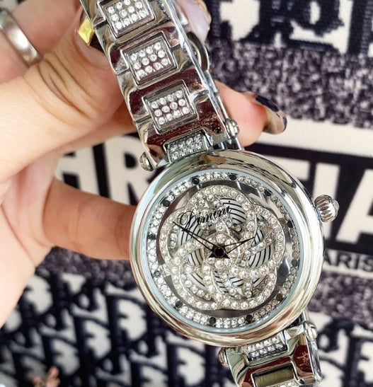Foreign trade hot style watch female steel watch lady quartz watch to turn the windmill surface douyin the same