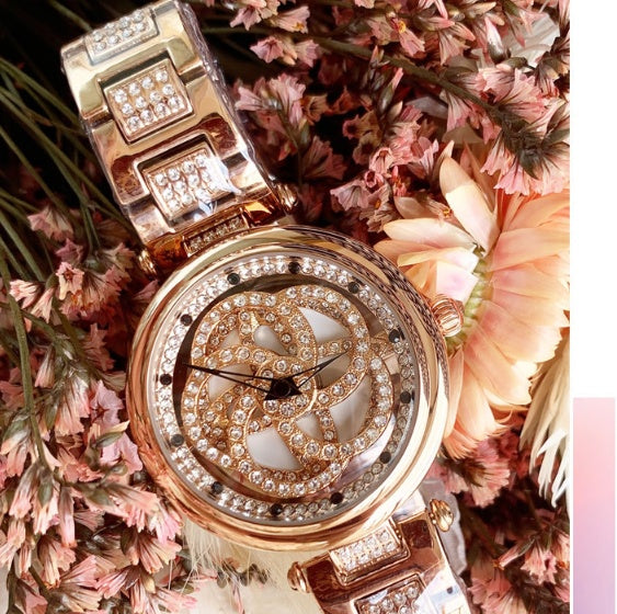 Foreign trade hot style watch female steel watch lady quartz watch to turn the windmill surface douyin the same