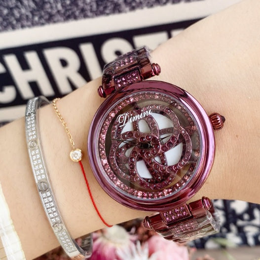 Foreign trade hot style watch female steel watch lady quartz watch to turn the windmill surface douyin the same