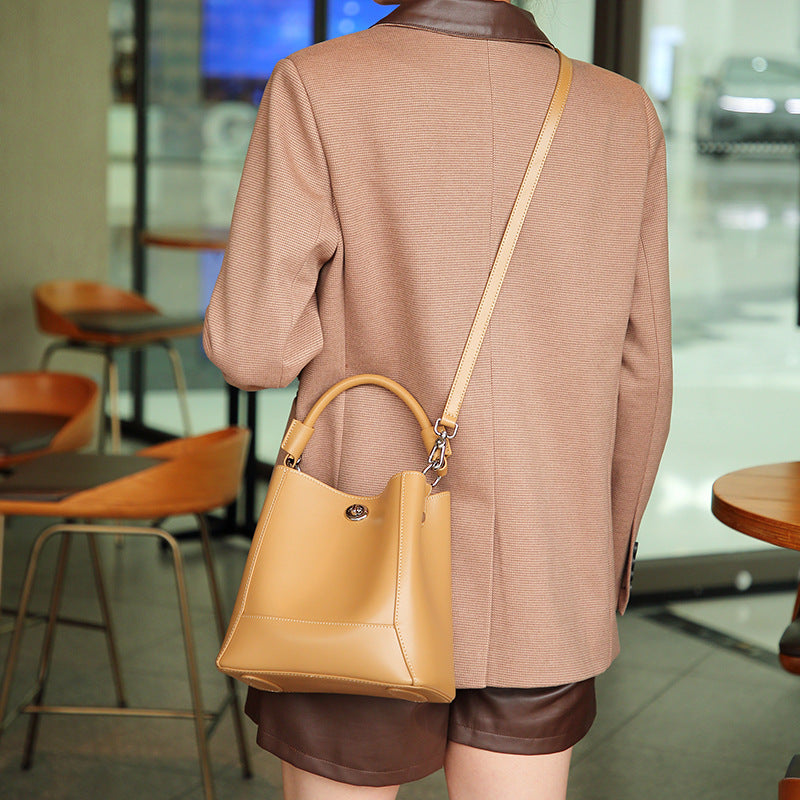 Structured Cowhide Bucket Bag with Turn-Lock Closure